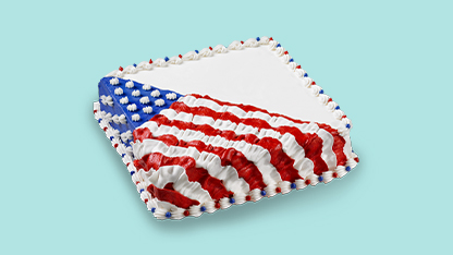 The American flag decorated cake on a blue background.